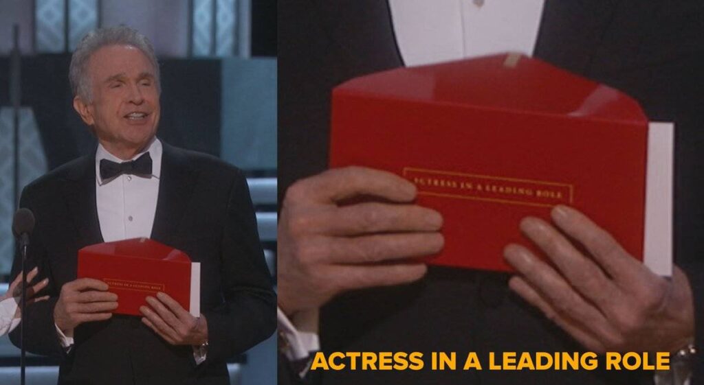Warren Beatty holding Oscar envelope